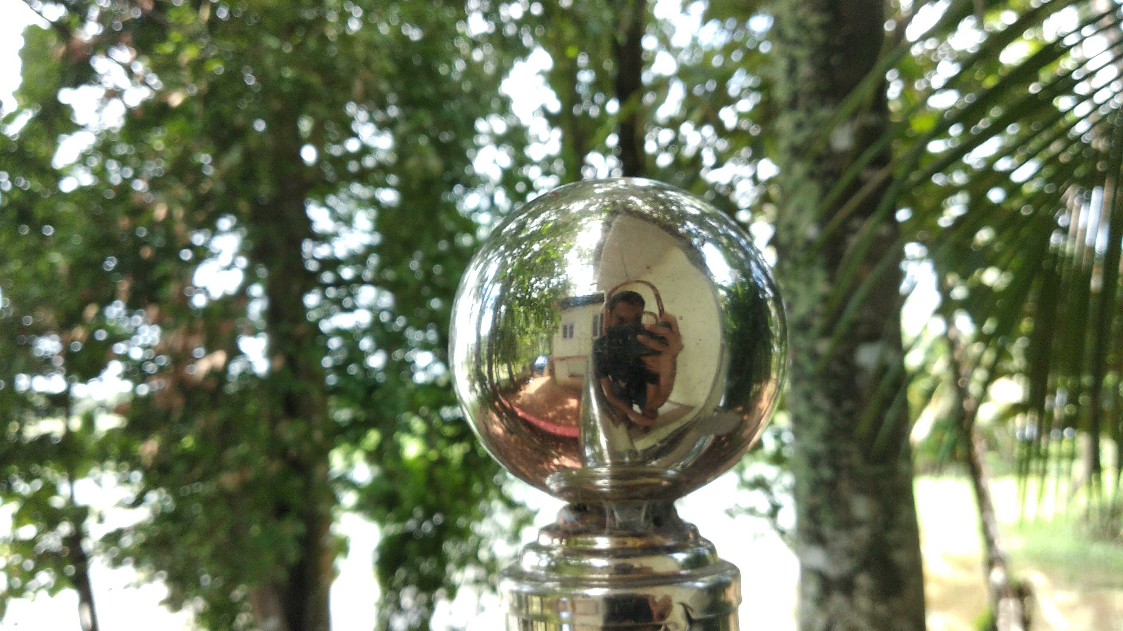 my reflection on a shiny ball